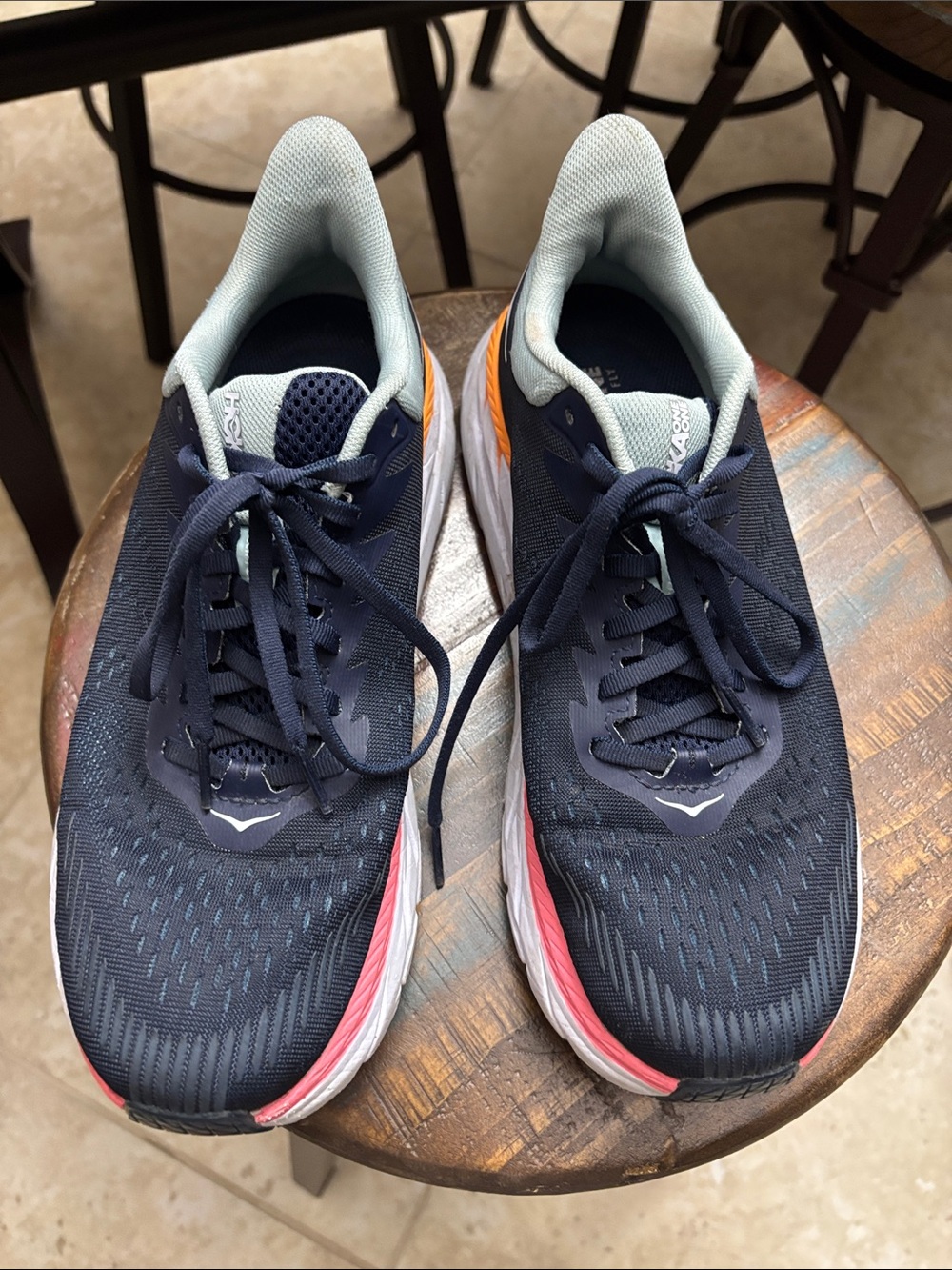 Hoka women’s Navy Running Shoes with Light gray Lining and Coral Accents